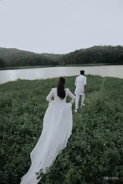 Couple walking together in a green landscape