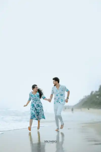 Couple running on the beach